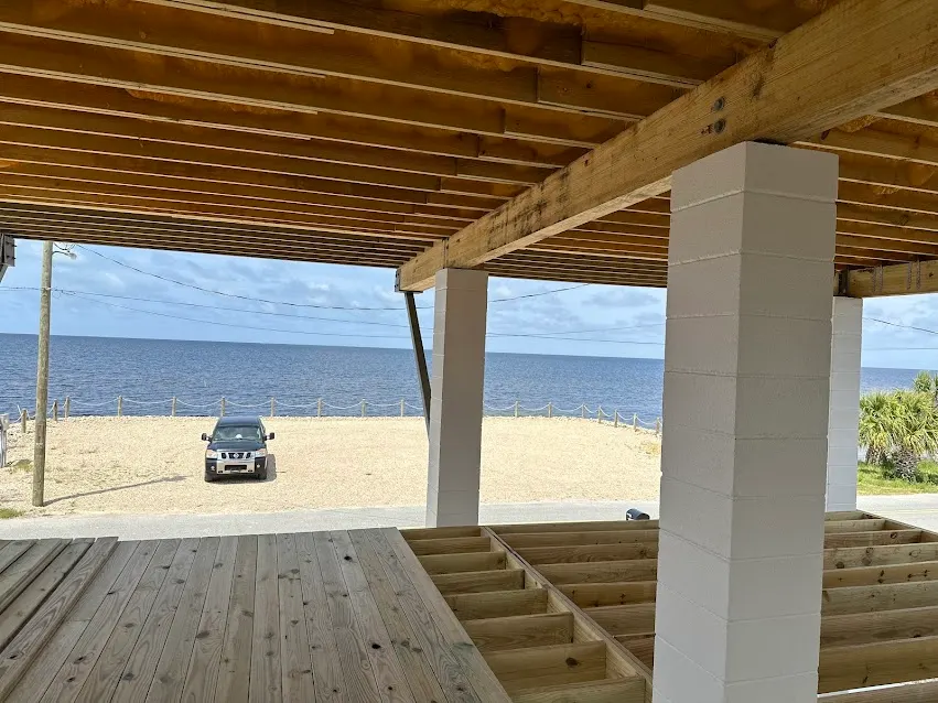 Wood deck framing under a covered waterfront structure