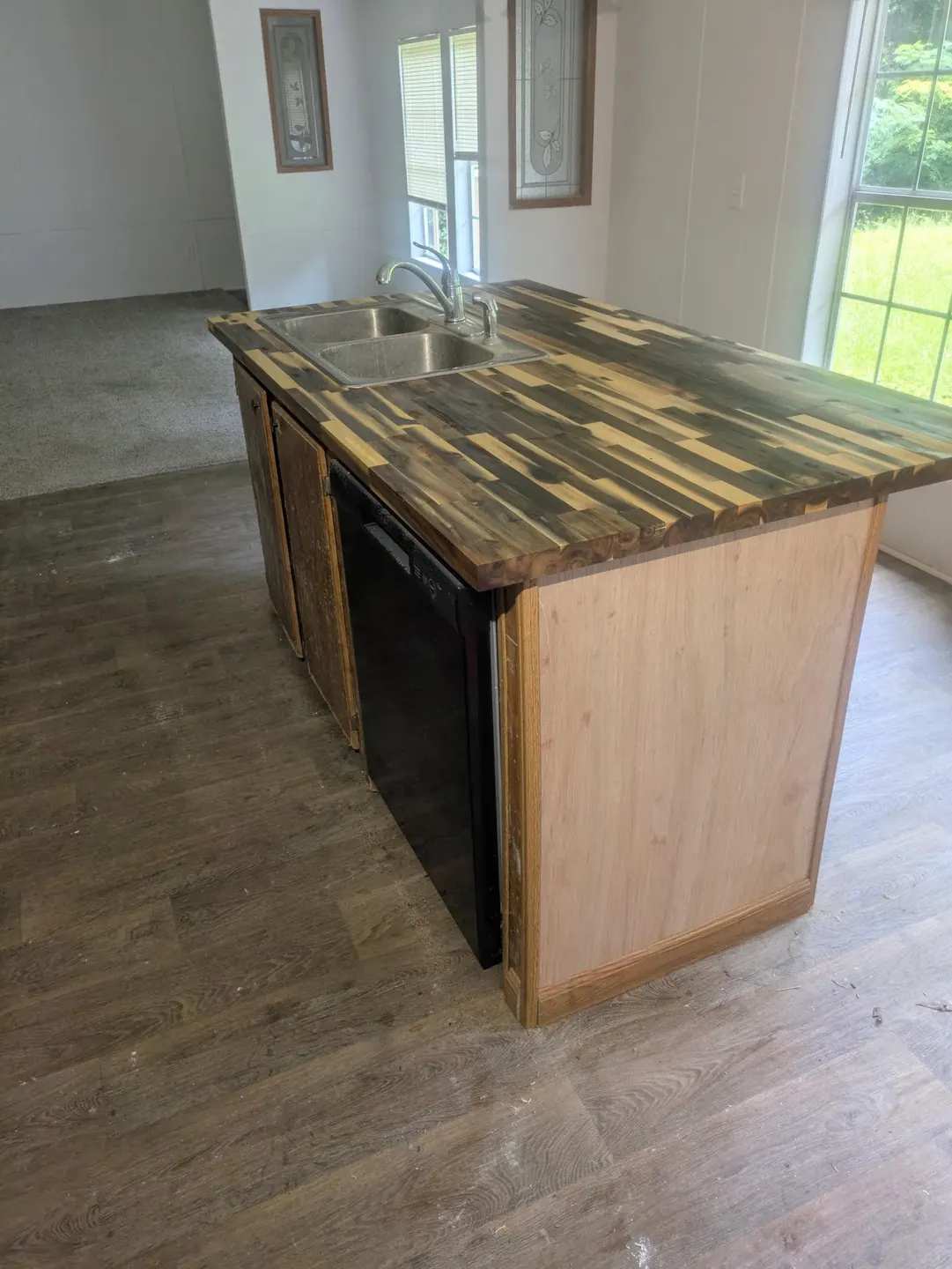 Kitchen island with wood countertop and cabinet updates