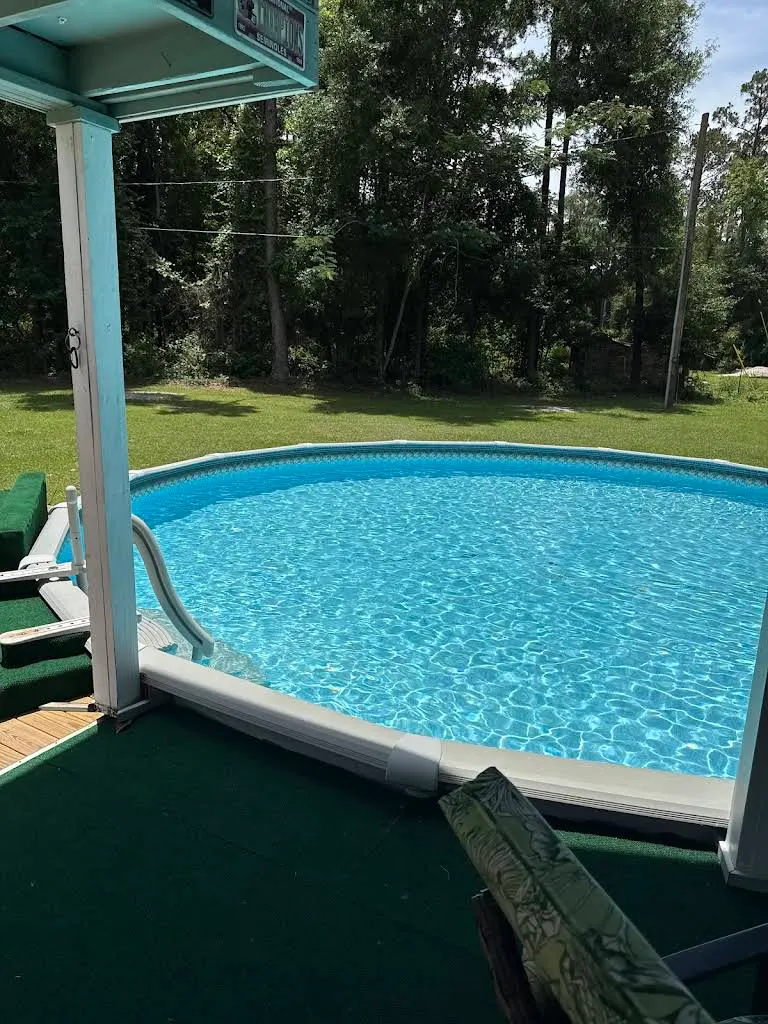 Above-ground pool area with surrounding outdoor space